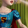 odditycollector: Crop of soft coloured Supergirl in a vintage style dress. Her symbol and lower face are visible. (Supergirl)