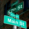 kitty_trio: street signs showing intersection of 57th Street and Main Street (57th & Main)