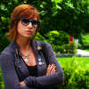 claudiometer: arms crossed, wearing sunglasses (future's so bright I gotta wear shades)