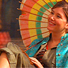 yvi: Kayle smiling under her colorful umbrella (Firefly - Kaylee sun)