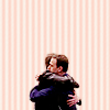 oxoniensis: dan and casey hugging, stripy background (fandom: sn arguing the toss)