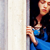 fizzyblogic: [Merlin] Morgana standing at her window looking down sadly (soldier battle scars)