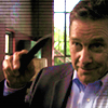 scripted_sra: Larry holding his knife, mid-gesture, waving goodbye. (burn notice: larry & his knife wave bye)