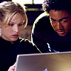 kass: Veronica and Wallace stare at a screen (veronica and wallace)