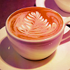the_coffee_shop: A mug of coffee with a leaf-like swirl in its center. (general)