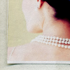 ar: We see a dark-haired woman (standing in for Promise from TCLS) wearing pearls looking to her left. (tcls - promise sleeps in pearls)