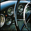 konsectatrix: photo detail of an alpha romeo car dashboard (ymmv - your mileage may vary.)