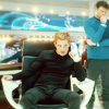 shopfront: Source: Star Trek 2009. Kirk in the Captain's chair in black clothes, Bones standing behind him. (Trek - [AOS] epic enterprise)