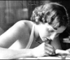 were_duck: a black and white photo of alice sheldon (james tiptree jr.) writing (Tiptree)