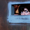 shopfront: Source: Torchwood. Gwen looking through a mail slot in a door. (Torch - [Gwen] can't see meeee)