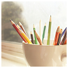 dirty_diana: colored pencils sit in an empty latte cup. (colored pencils)
