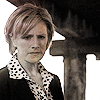 chief_mom: Chief Karen Vick, a blonde white woman, looking down, a disturbed frown on her face (Disturbed)