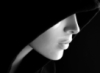 vampkilmer: Black and white photo of a woman's profile, her face half covered by a hood. (Between Darkness and Wonder, Carlos A. A. Pereira)