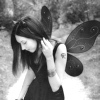 originalpuck: B&W image of a woman with tattoos and fairy wings. (fairywoman)