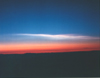 lo_rez: NASA sunset image, barred color blue-white-red-black (sky, cloud, sun-on-horizon, earth) (Sundown)