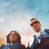 skieswideopen: Dani Reese and Charlie Crews standing side-by-side looking down (Life)