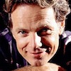 bookblather: Bruce Greenwood resting his chin on his folded hands and smiling. (in the heart : nathan : bruce greenwood)