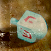 phoenixsong: Blue dreidel with red Hebrew characters. (dreidel)