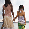 busaikko: a woman and girl holding hands on the beach (x woman and child)