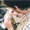 distractionary: dark-haired young man in plaid shirt eating a sandwich (it's peanut butter jelly time!)