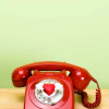 wireless: red telephone / green background (Stock: sober)