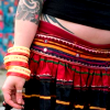 wireless: tattoed belly / girl / hippie skirt (Stock: body artists on a fissure)