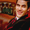 thewarbler: (over shoulder grin)
