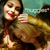 fish_echo: Kaylee and Inara from Firefly hugging, text: huggles (Fandom-Firefly-Kaylee & Inara hugging)