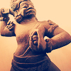 ananzi: (dancing statue)