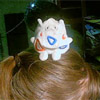 moonreviews: My Togepi beany plush sitting on my head. (togepi-on-my-head)