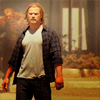 mjolnir_retriever: Thor in t-shirt and plaid and jeans, walking forward on a devastated street (showdown at the OK corral)