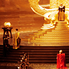 mjolnir_retriever: Thor and Loki kneeling before (and dwarfed by) the gold steps leading up to Odin's throne (brothers before Asgard's golden throne)