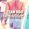 highlander_ii: Danno&#39;s butt in swim trunks hauling a surfboard ([z-landcomm] 007)