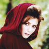 ar: A pale, dark-haired woman in a red hood. (pd - like little red riding hood)