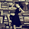 highlyeccentric: A woman in an A-line dress, balancing a book on her head, in front of bookshelves (Make reading sexy)