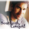 rhi: Matthew McCormick smiling in a t-shirt.  "Southern Comfort." (Southern Comfort)