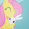alittlekindness: Fluttershy smiling and hugging her pet rabbit (animal lover)