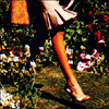 owl: woman's lower leg with high-heeled shoe, walking in a garden (shoes)