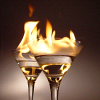 alwayswondered: Two cocktail glasses with flaming drinks in them. (through a glass darkly)