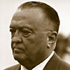 halialkers: J. Edgar Hoover, right profile view. Receding hair line, short nose, beady eyes (Agati)