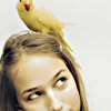 tree: a bird perched on a girl's head ([else] is in my tree)