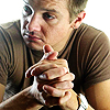 bookblather: Jeremy Renner with clasped hands, looking to his right. (Peter Edleson : Jeremy Renner)