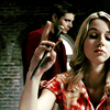 allfireburns: Jo Harvelle, playing with a knife. Dean in the background. (and fuck you too. :))