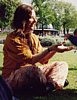sashajwolf: photo of me sitting on the grass with hands extended (park)