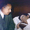 thingswithwings: Holmes lies in bed with Watson sitting worried nearby (holmes - h in bed w nearby aw)