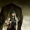 lunchee: 2NE1's Park Bom with green hair holding an umbrella from the 'It Hurts' MV (Bom Umbrella)