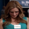 lilly_c: Maura looking down at the geek label on her dress (Maura - geek)