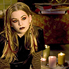 heuradys: Reggie decked out in pseudo-goth makeup, clothes. candles on floor. (reggie)