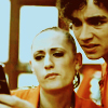 binz: nathan and kelly from "misfits" look with confused and considering faces at a mobile phone ([ misfits ] what am i looking at?)