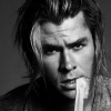 the_huntsman: chris hemsworth, brow furrowed, unwrapping a bandage from his hand with his teeth. (curious biting bandage)